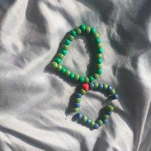 One size color is green light green blue and a heart